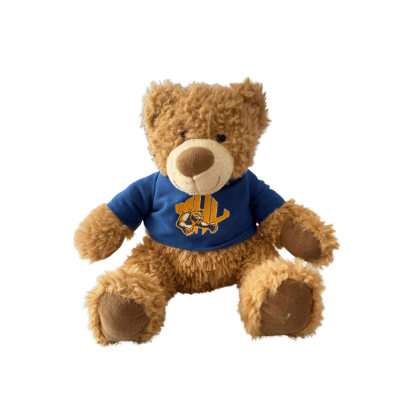 Brown fuzzy stuffed bear wearing a blue MHU tshirt with the athletics logo