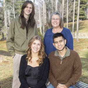 A heritage student and three family members pose.