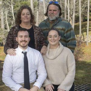 A heritage student and three family members pose.