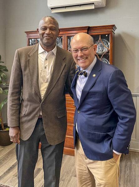 Cornell Sweeney, left, poses with Pres. Tony Floyd