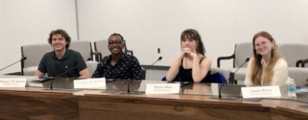 left to right: TJ Burske, AJ Rivers, Alexis Allen, and Cassie Berry sit behind their nameplates during the Ethics Bowl